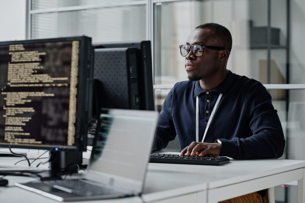 developer concentrating on his computer in a workplace