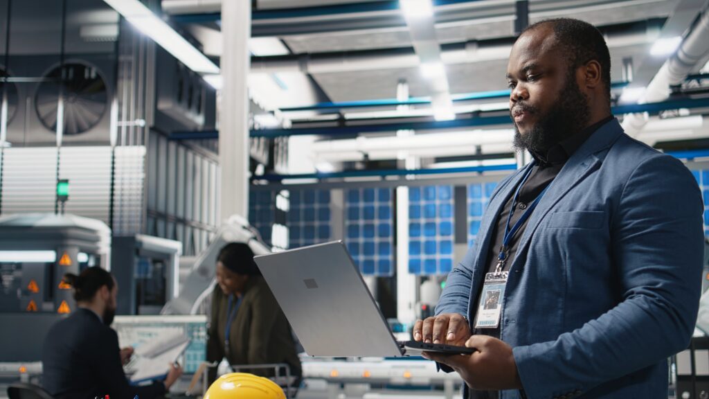 manager overseeing production at a tech plant