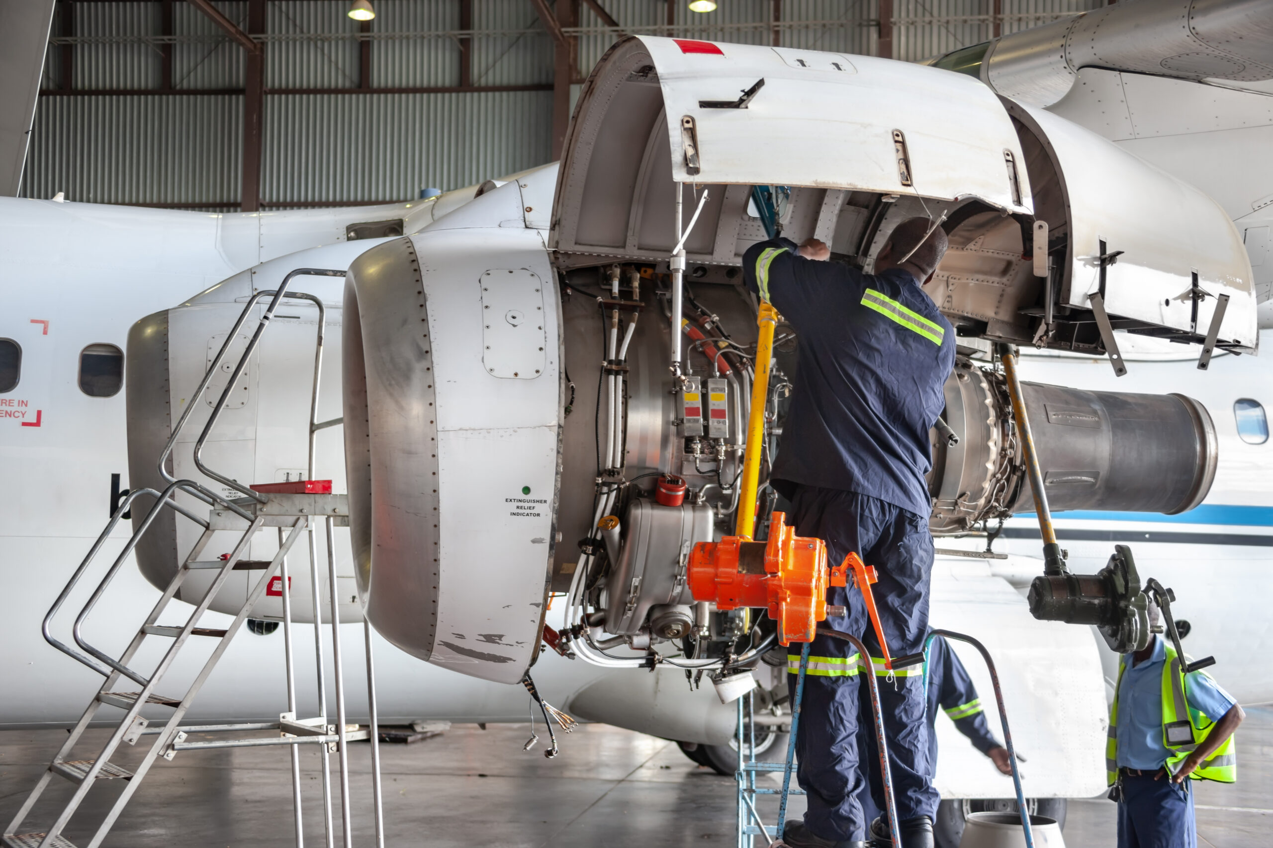 aviation MRO repairing plane engine in the hangar